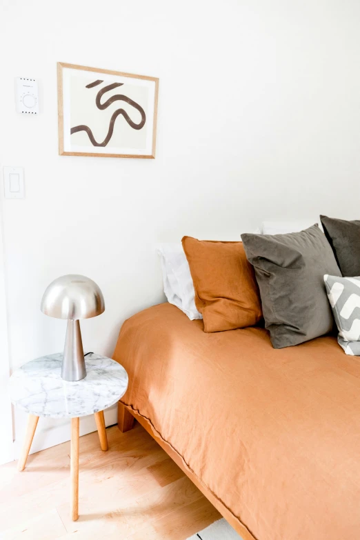 a room with a bed that has some pillows on it