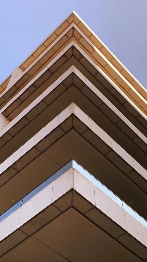 an upward s of a brown colored building