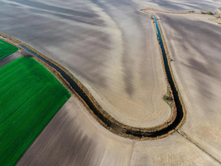 a winding path in the middle of a field