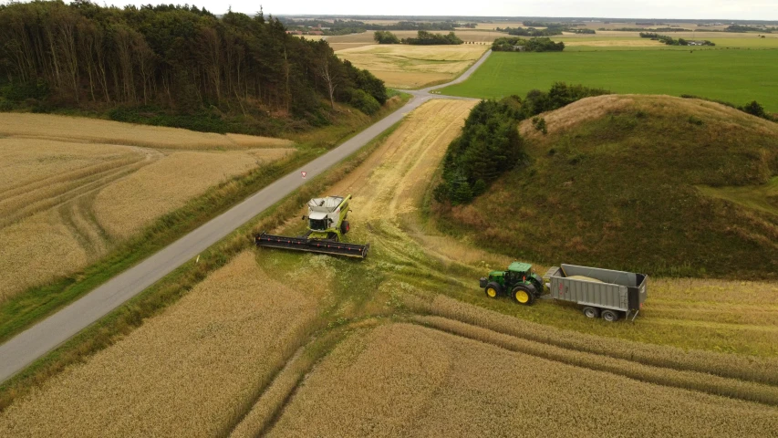 aerial pograph of a combine on a rural road