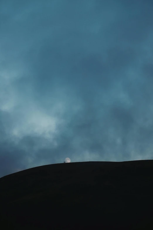 a person is riding their surfboard up a hill