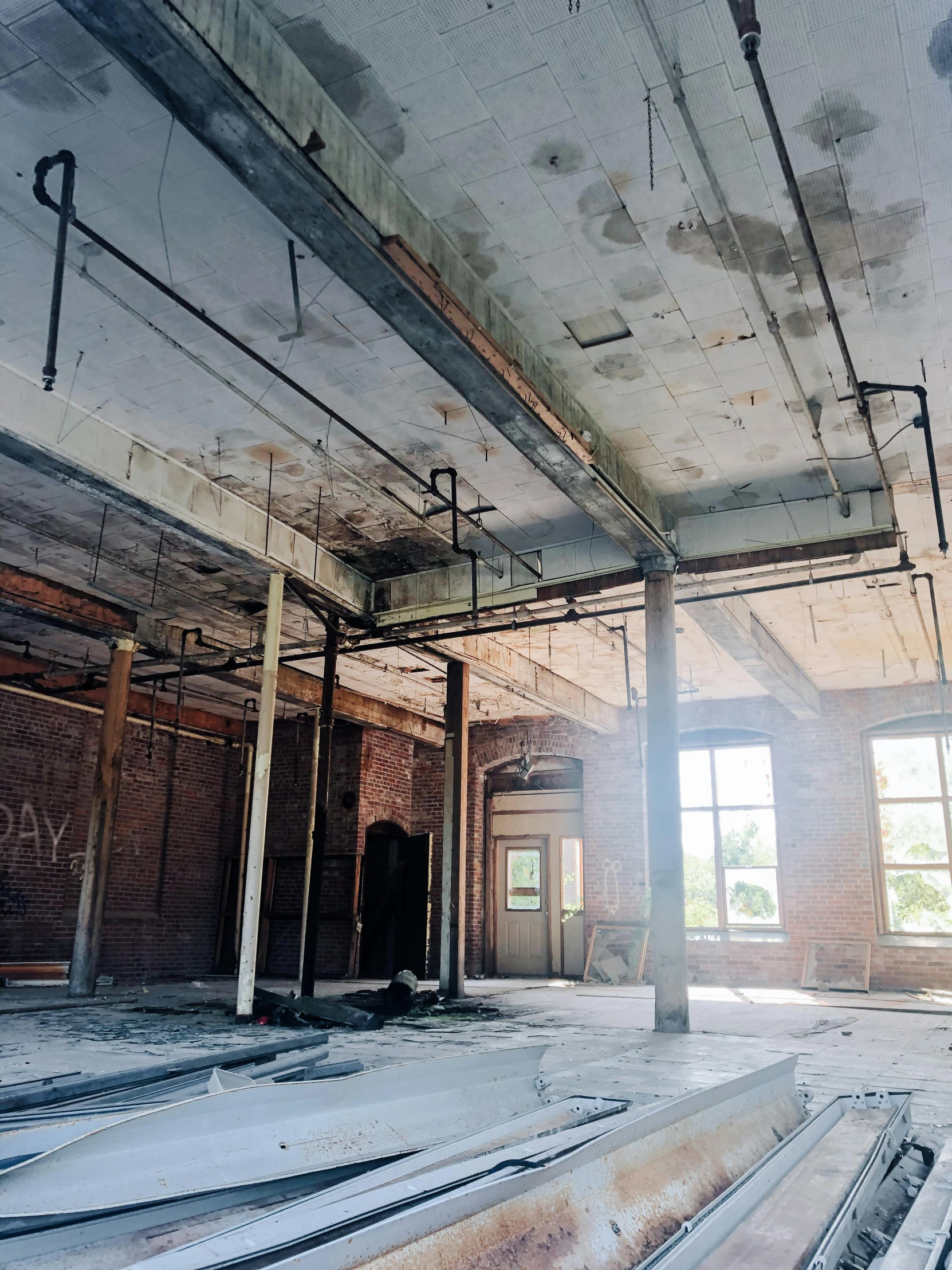 the interior of an old building with beams and windows