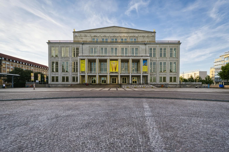 a big building has windows on it and many doors in it