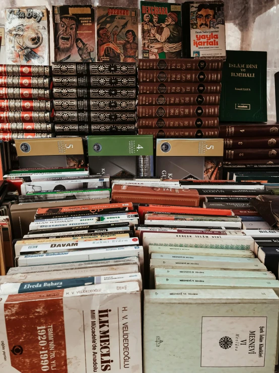 rows and rows of various colored books sitting on top of each other