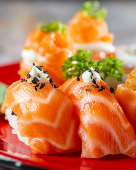 a plate full of sushi with garnishes, including an egg roll and shrimp