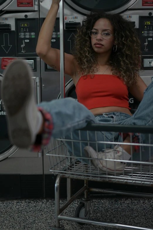 an older woman sitting in a laundry machine