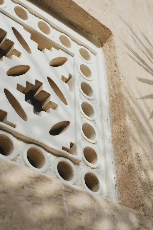 a large white vent on the side of a building