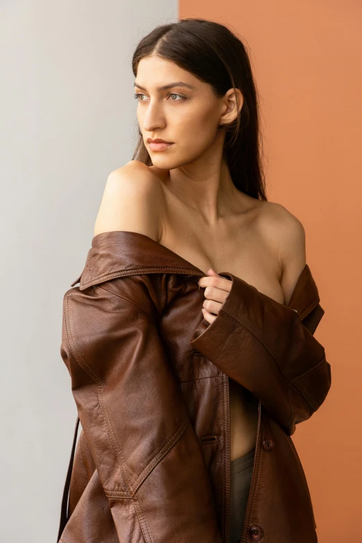 a model in a leather outfit and coat