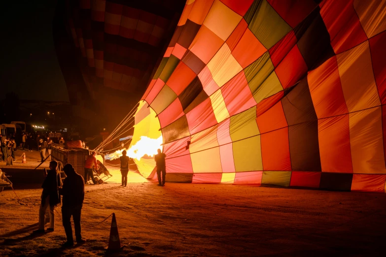 several people looking at the inside of a  air balloon