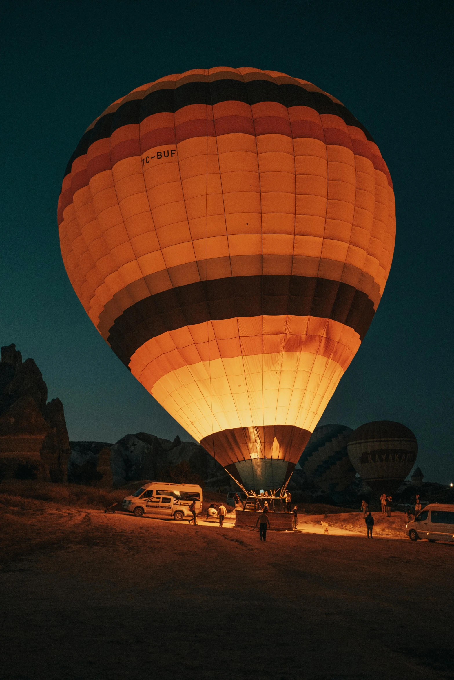 the back of a  air balloon illuminated at night