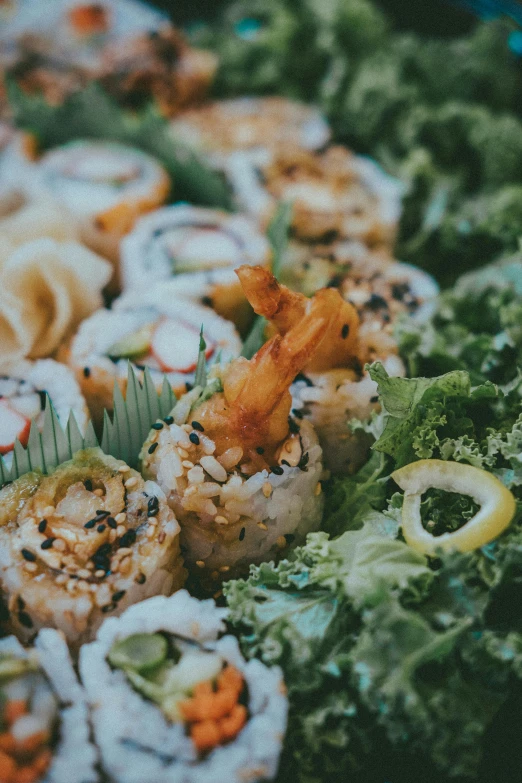 a group of sushi sits on display for everyone to enjoy