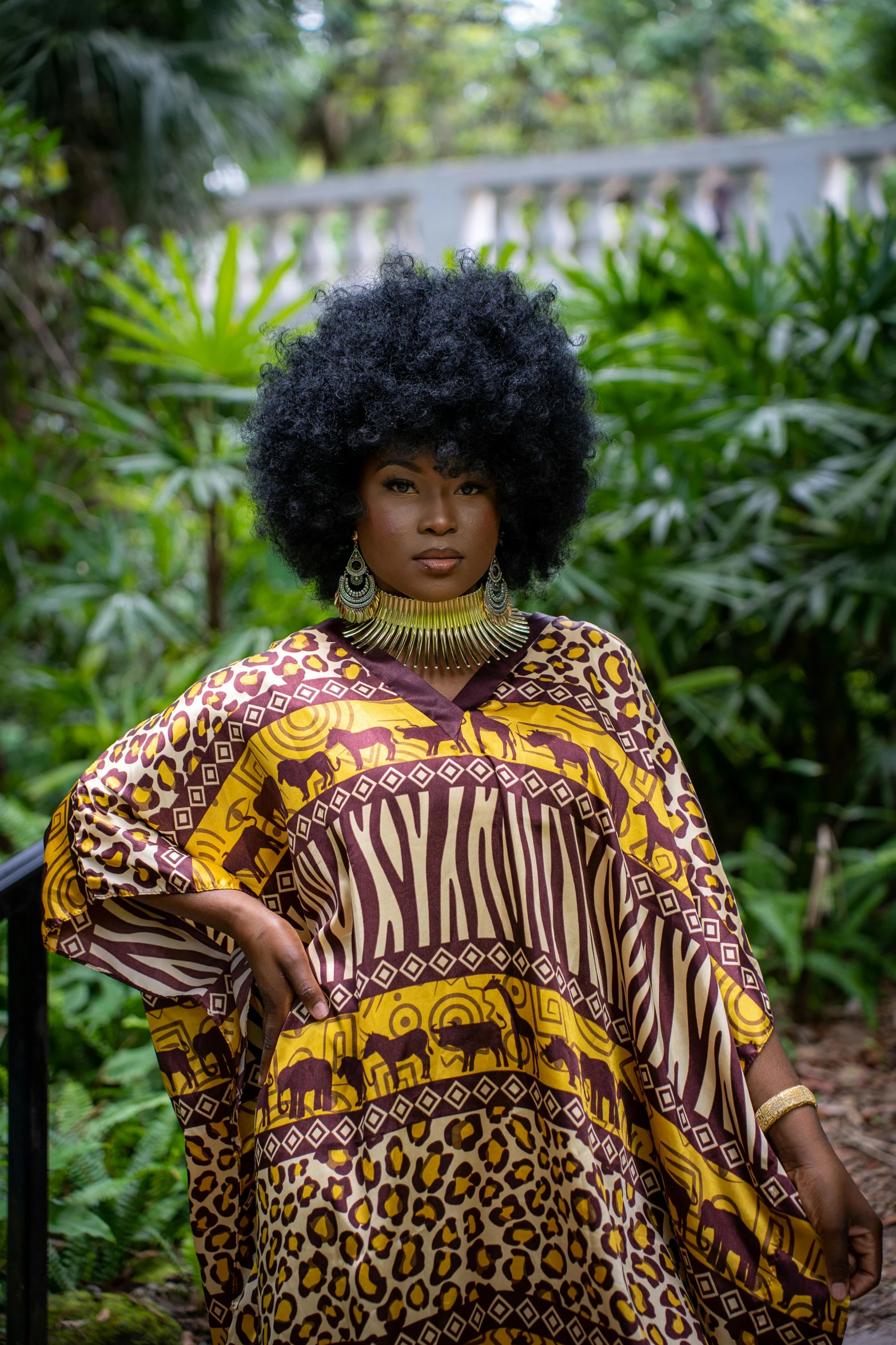 a person standing with a dress on in front of some trees