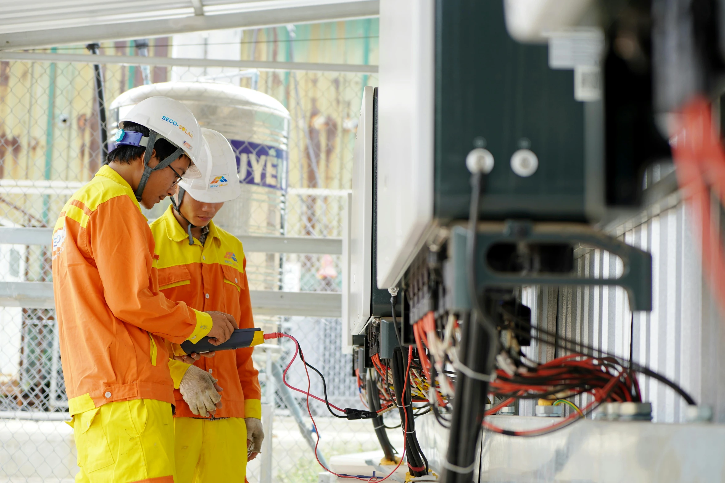 two technicians are working on a project