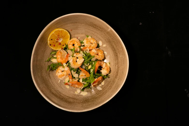 the shrimp and vegetable salad is prepared in a dish