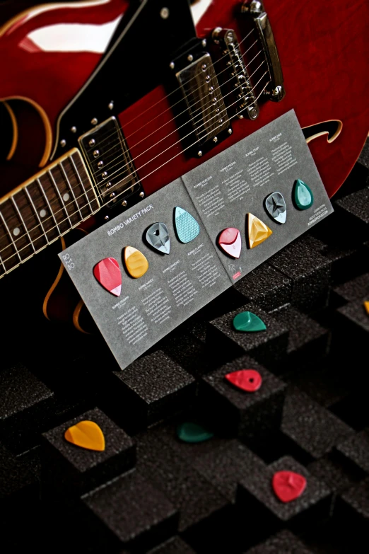 two guitars and a guitar on a table