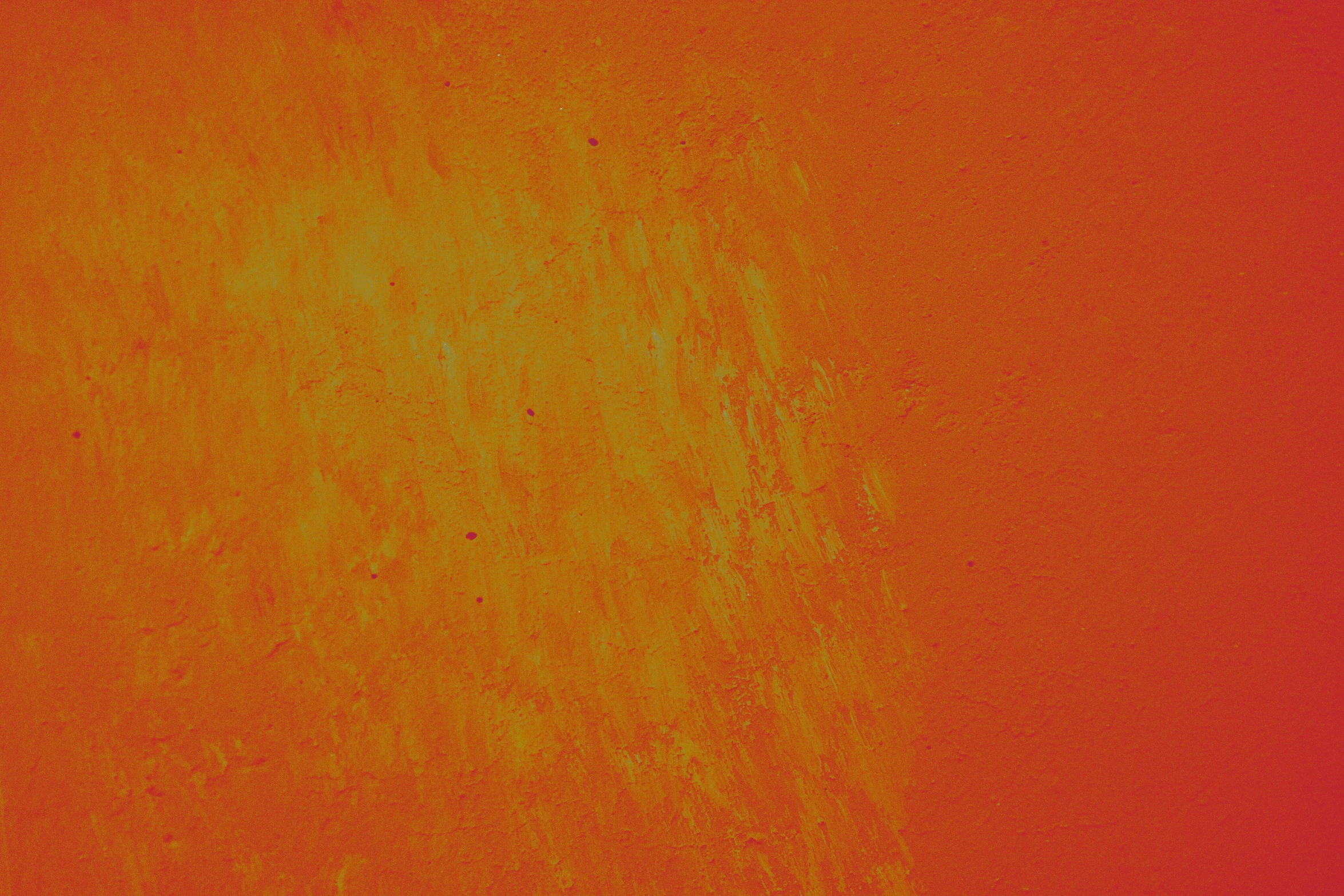 an orange and yellow background with red areas