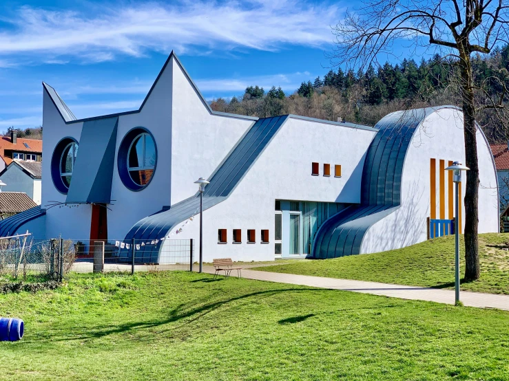 a modern, unusual building has round windows