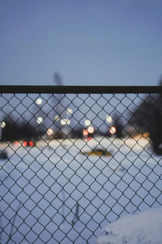 the view through a chain link fence at an airport