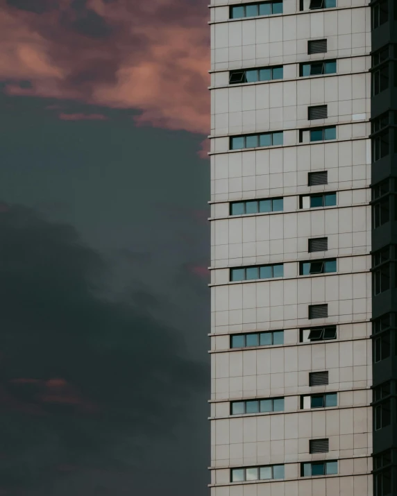 a large building with lots of windows and lights on it