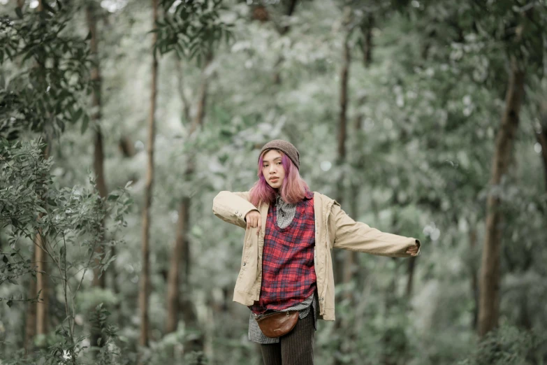 a girl with pink hair is wearing a coat and jacket