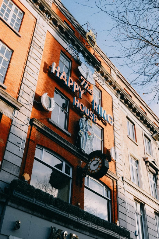 a store front with a large clock on it's side