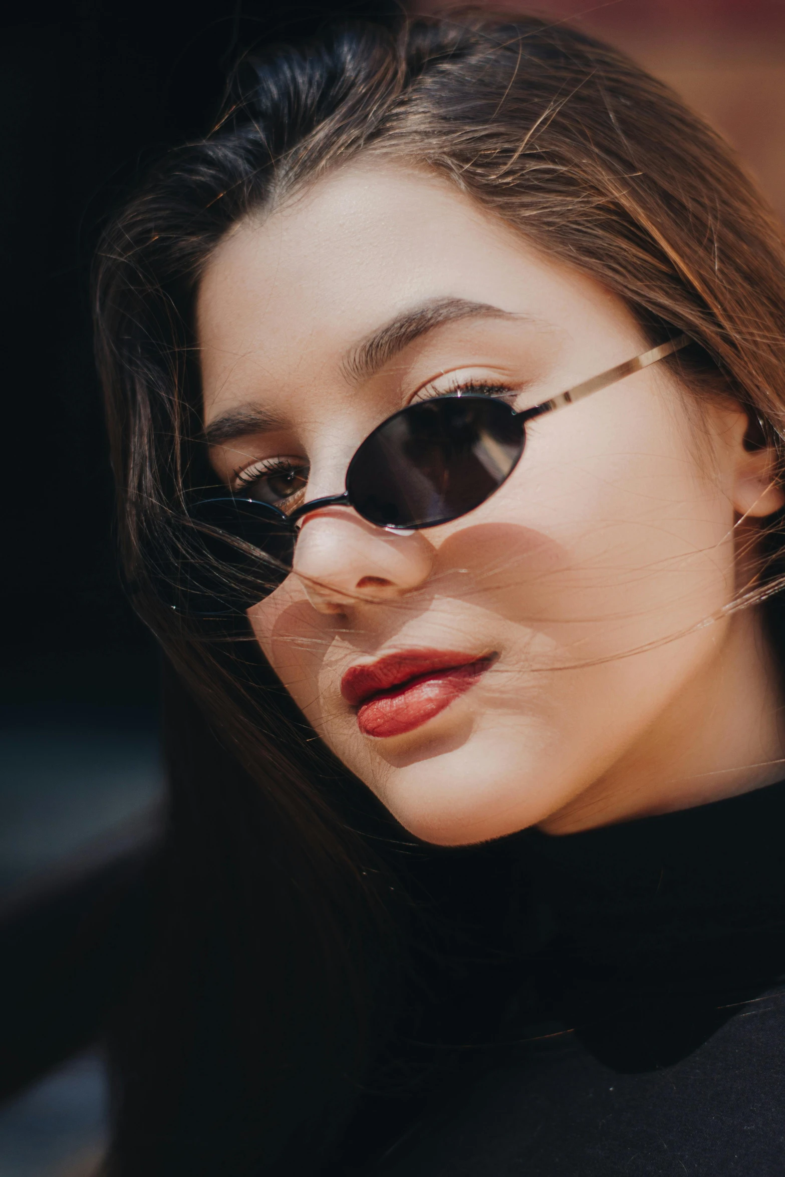 woman with cat eye sunglasses and dark hair