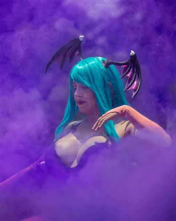 a woman with long blue hair holding a cigarette and wearing wings