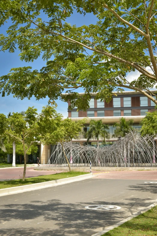 a water fountain in the foreground of an office building