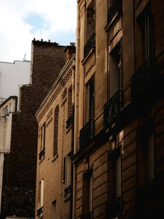 some tall buildings on the side of a road