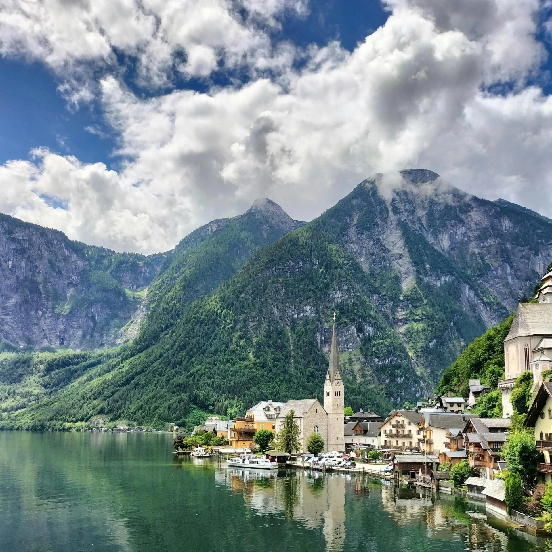 a village sits on the shore of a lake