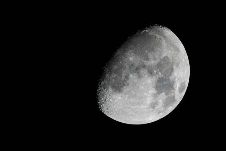 a very big moon in the dark sky