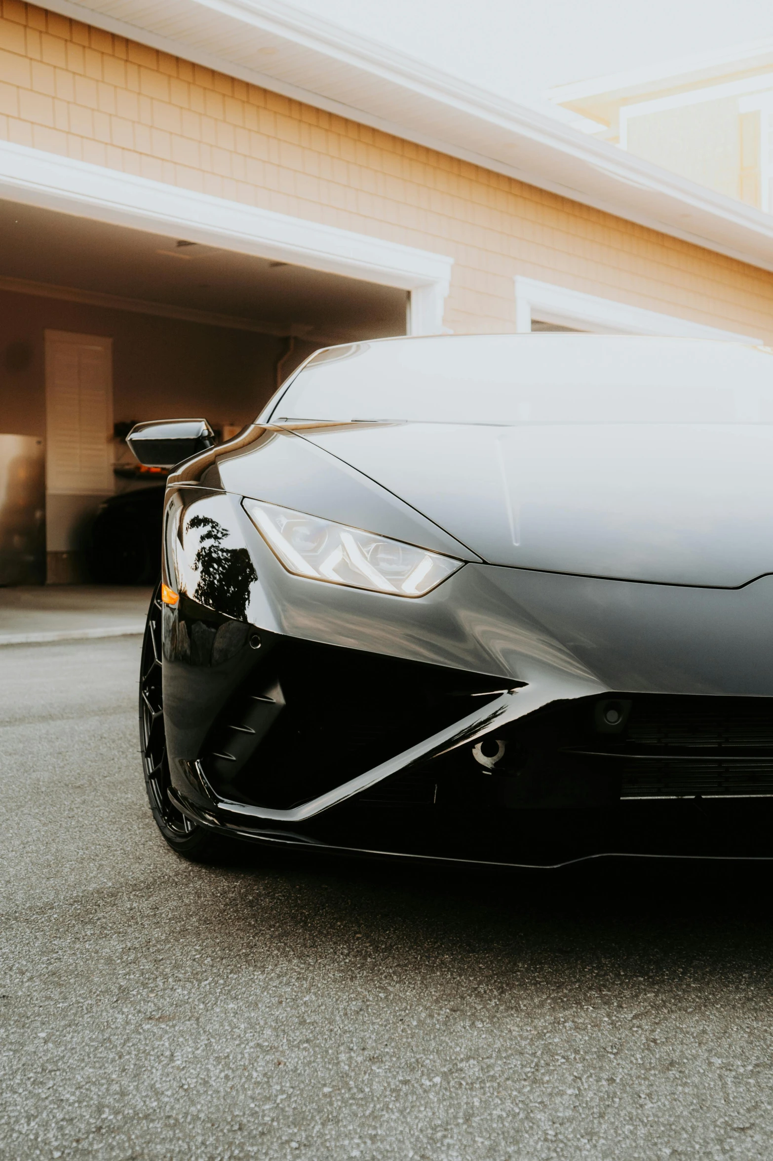 a black sports car parked in front of a building