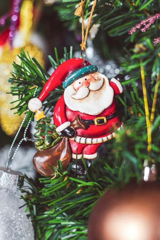 a christmas tree is decorated with decorations like santa clause