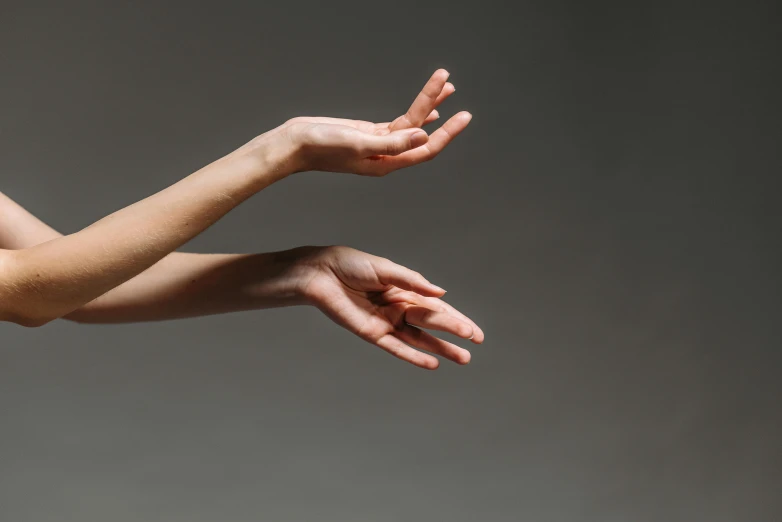 a person that is reaching up with their hands