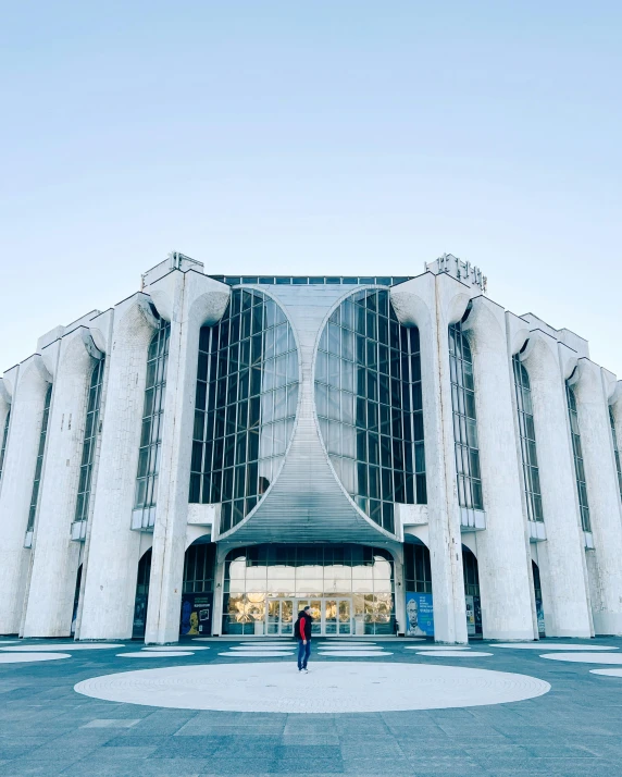 the entrance to a building with a person standing in front