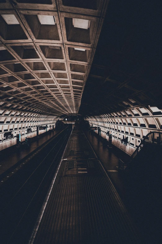 a train station with rows of empty seats