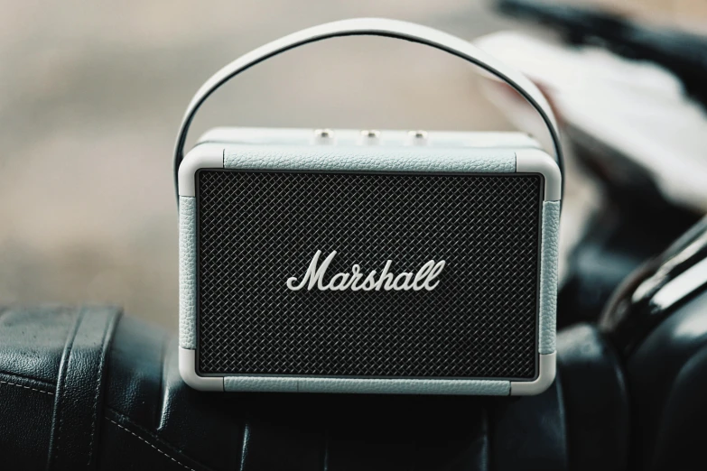 a metal and black speaker with the word marshall on it