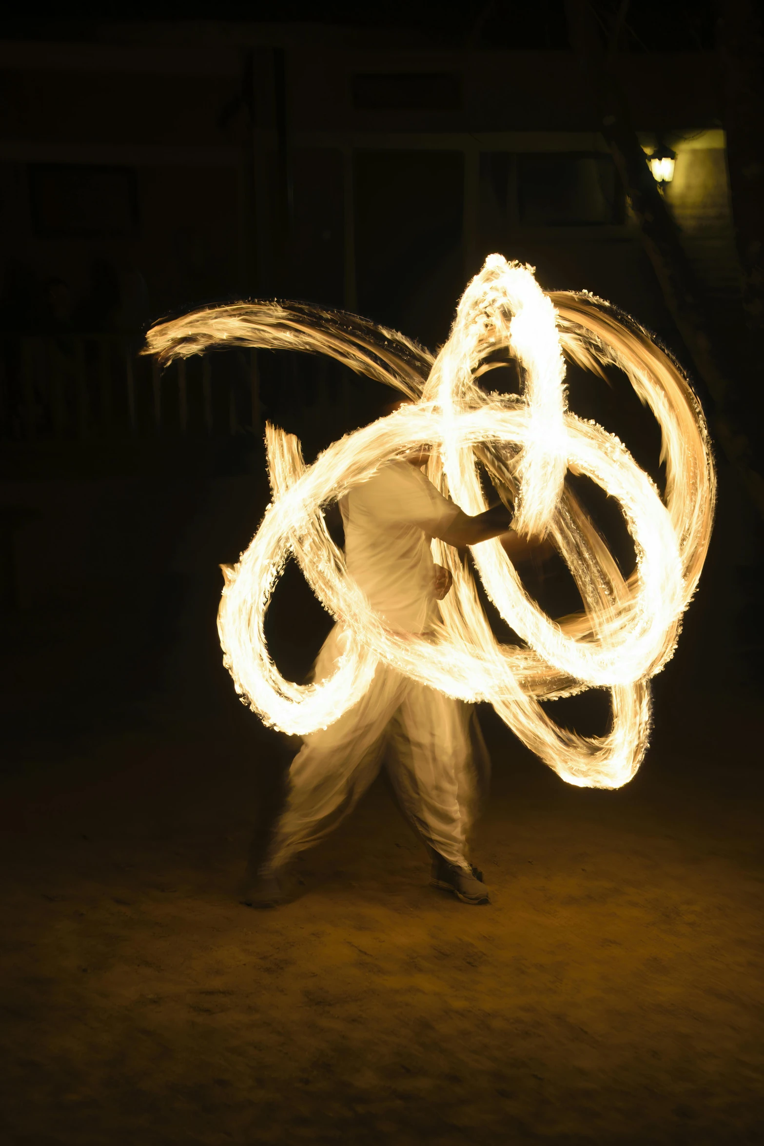 a man holds a hula hoop on a street