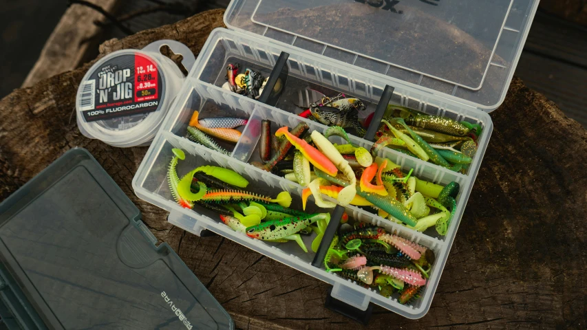 lures and tools sit in the tackle box of a large body of water