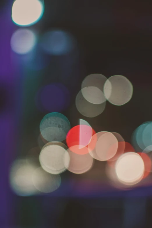 blurred image of colorful lights and some streetlights