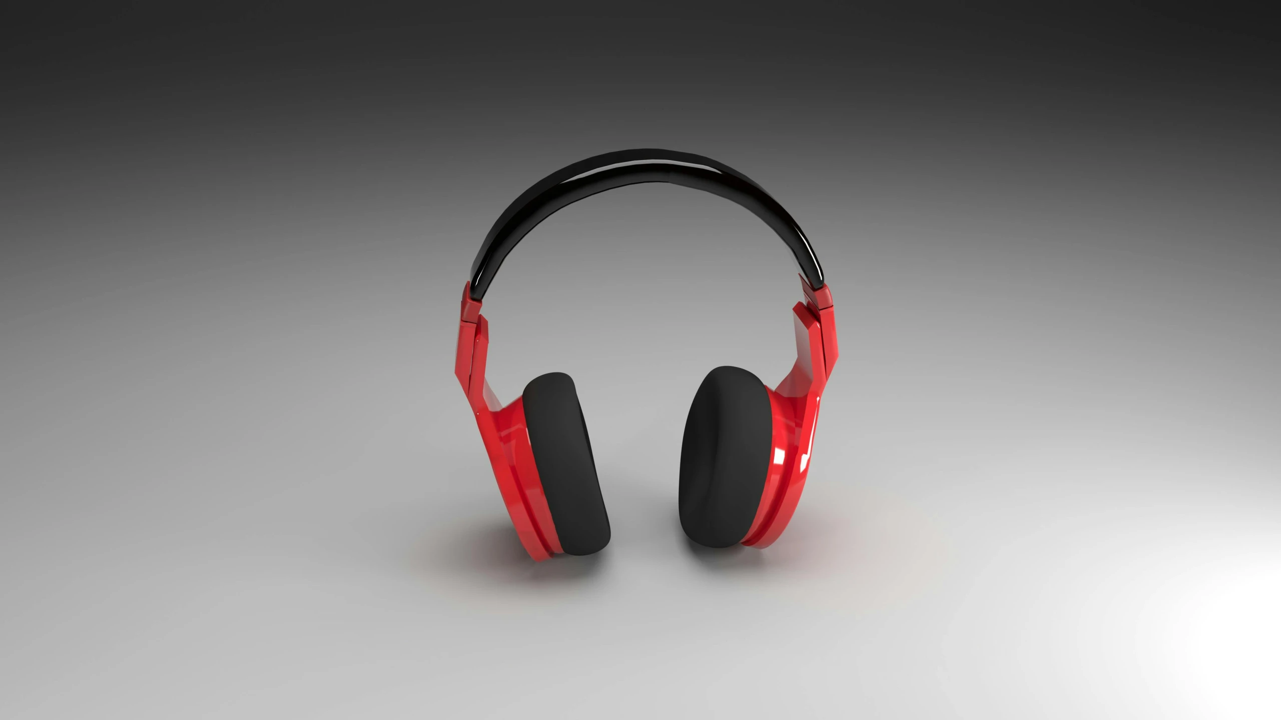 a pair of red headphones with black and red ear cushions