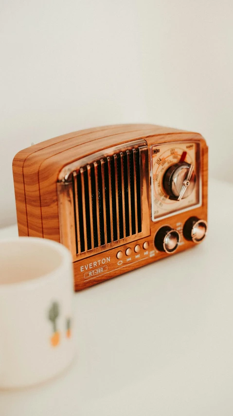 an old radio sitting on top of a table