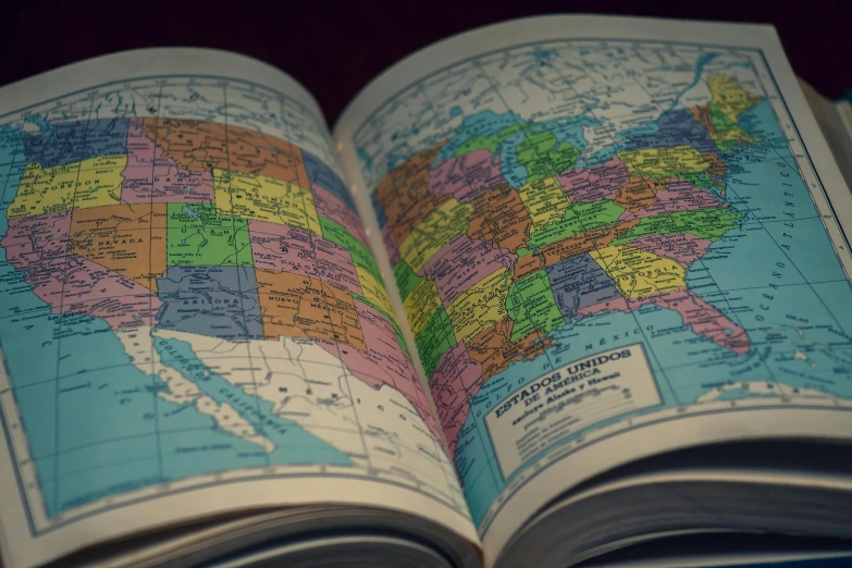 an open book shows a map of the united states