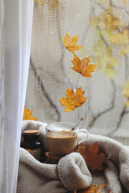 a coffee mug on top of a white blanket