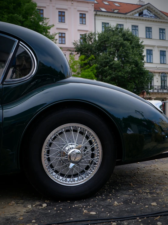 a shiny green car on the street