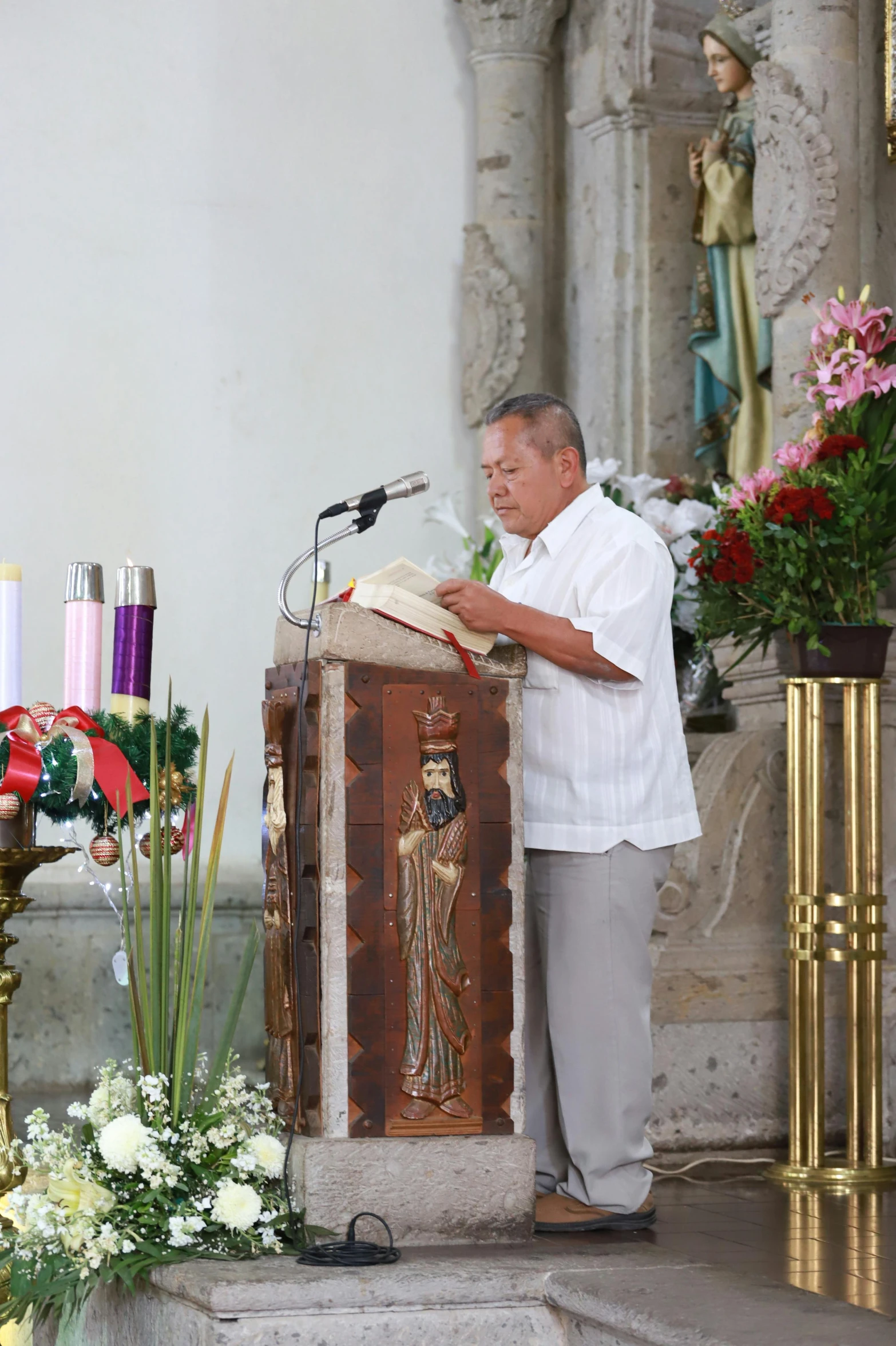 the priest is standing by the alter of his shrine