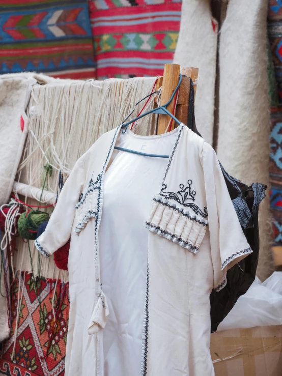 the dresses are on display for purchase at this market