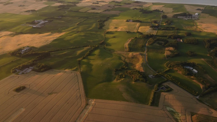 a plane is flying over a big field