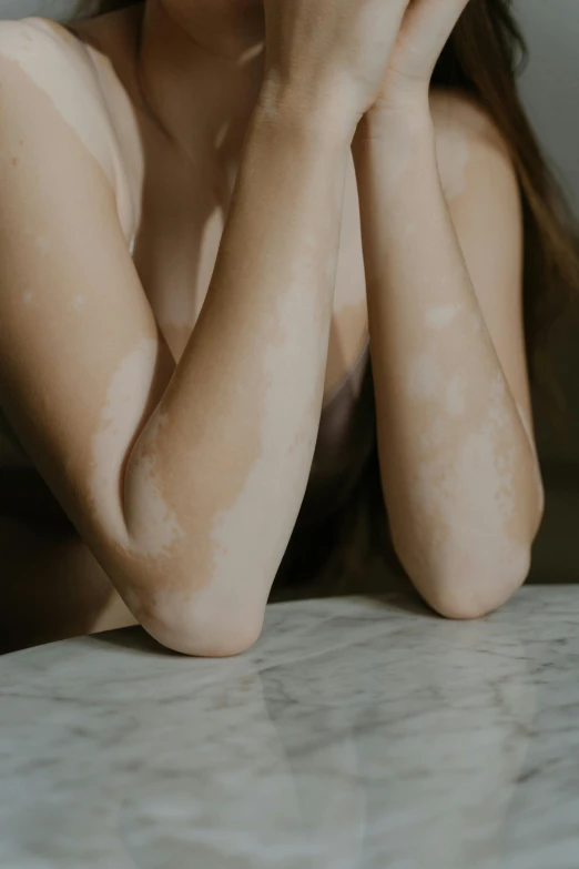 a close up view of a woman with wet skin on her body