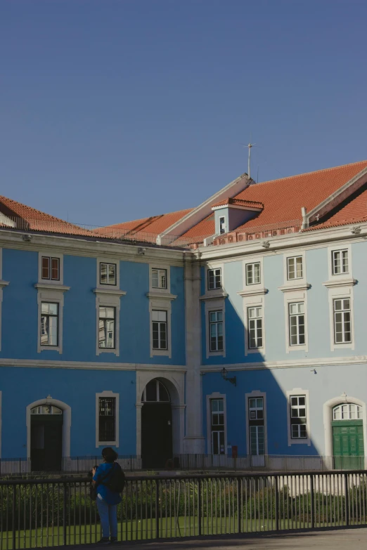 a building with blue and tan tiles